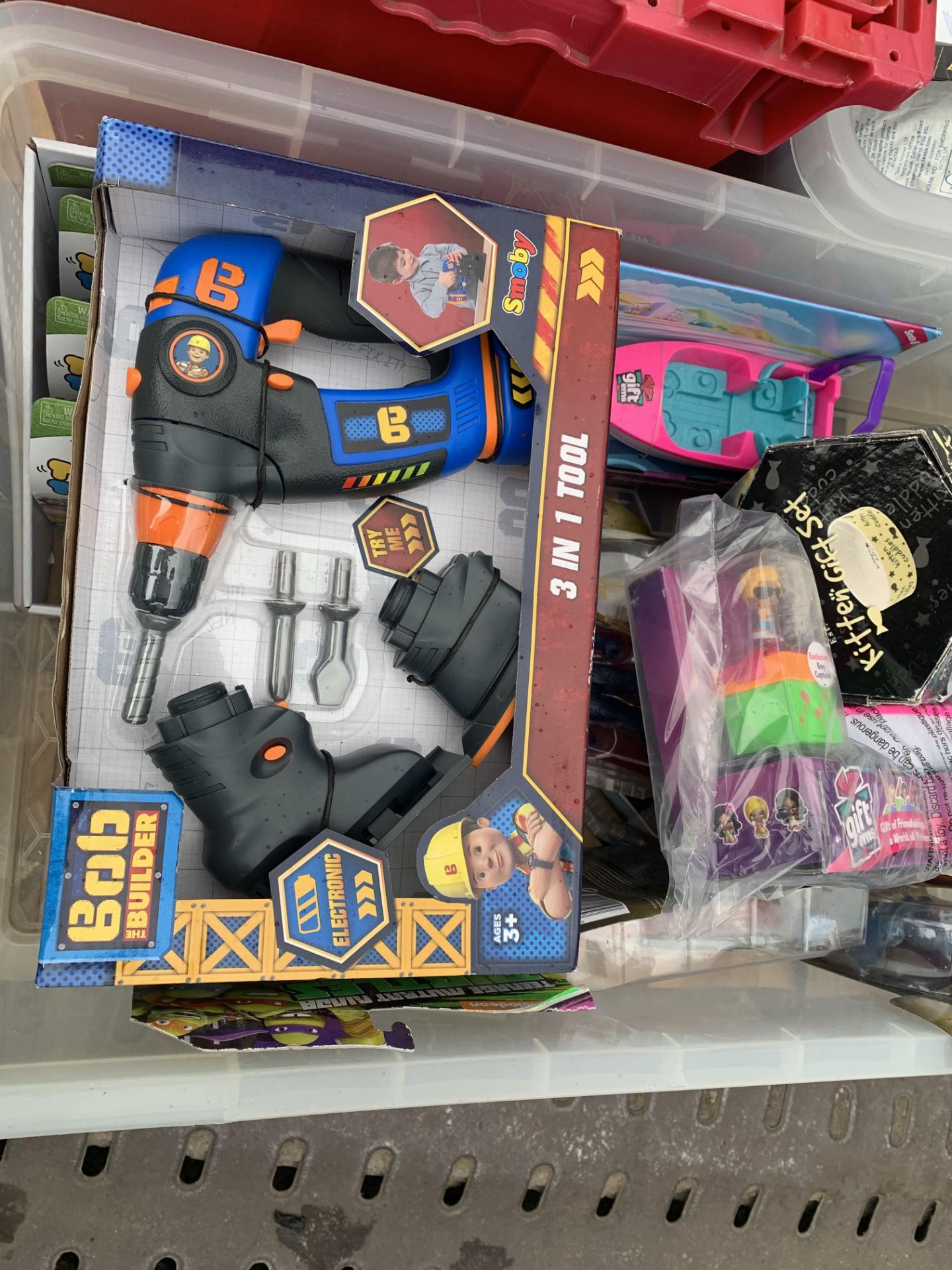 MIXED LOT CONTAINING UNDER ARMOUR CAPS, DVDS, COMPUTER GAMES, BOB THE BUILDER TOYS, ACCESSORIES ETC - Image 11 of 11
