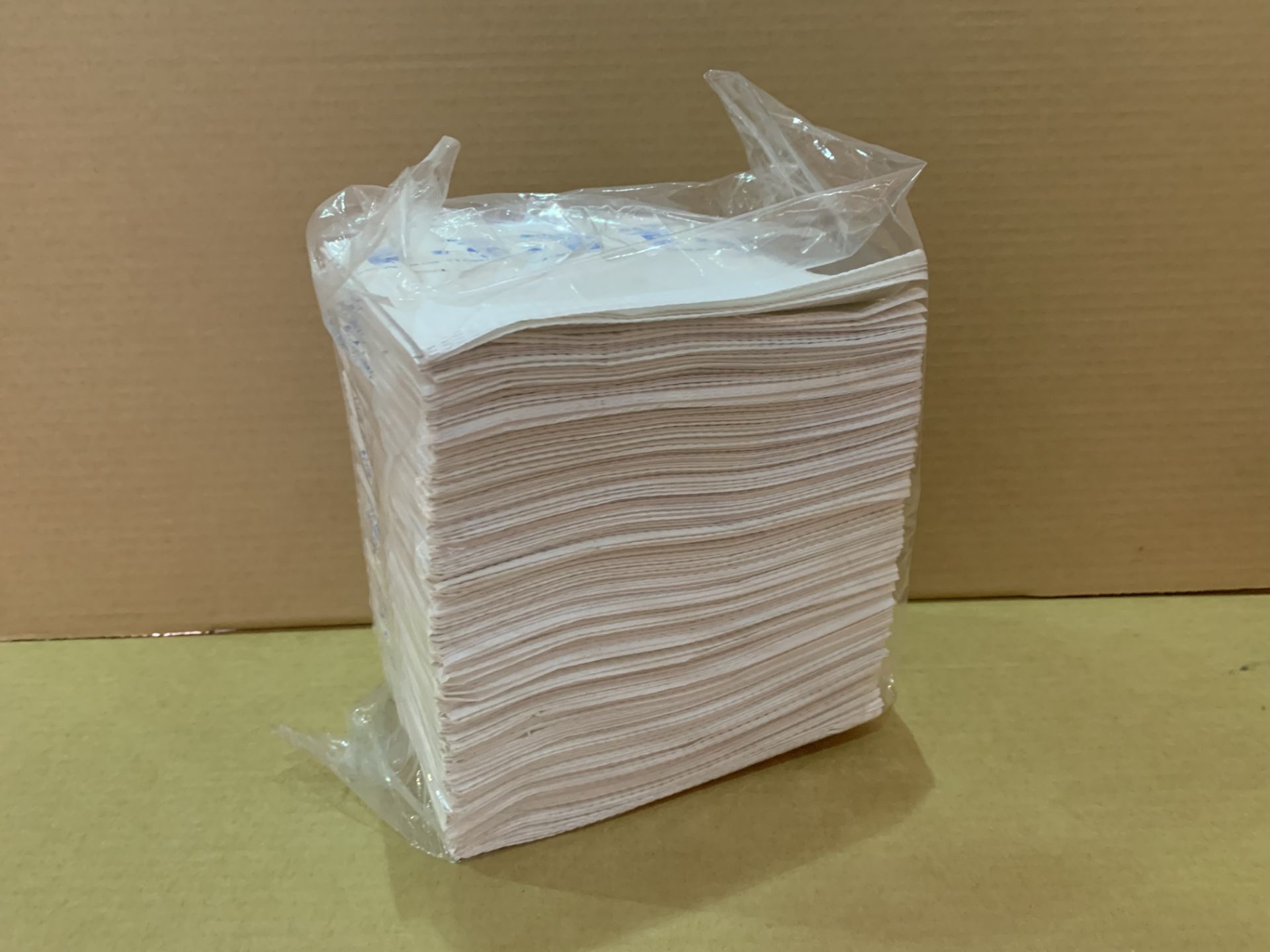 5400 BRAND NEW ADULT NAPKIN SPILL PROTECTORS IN 9 BOXES