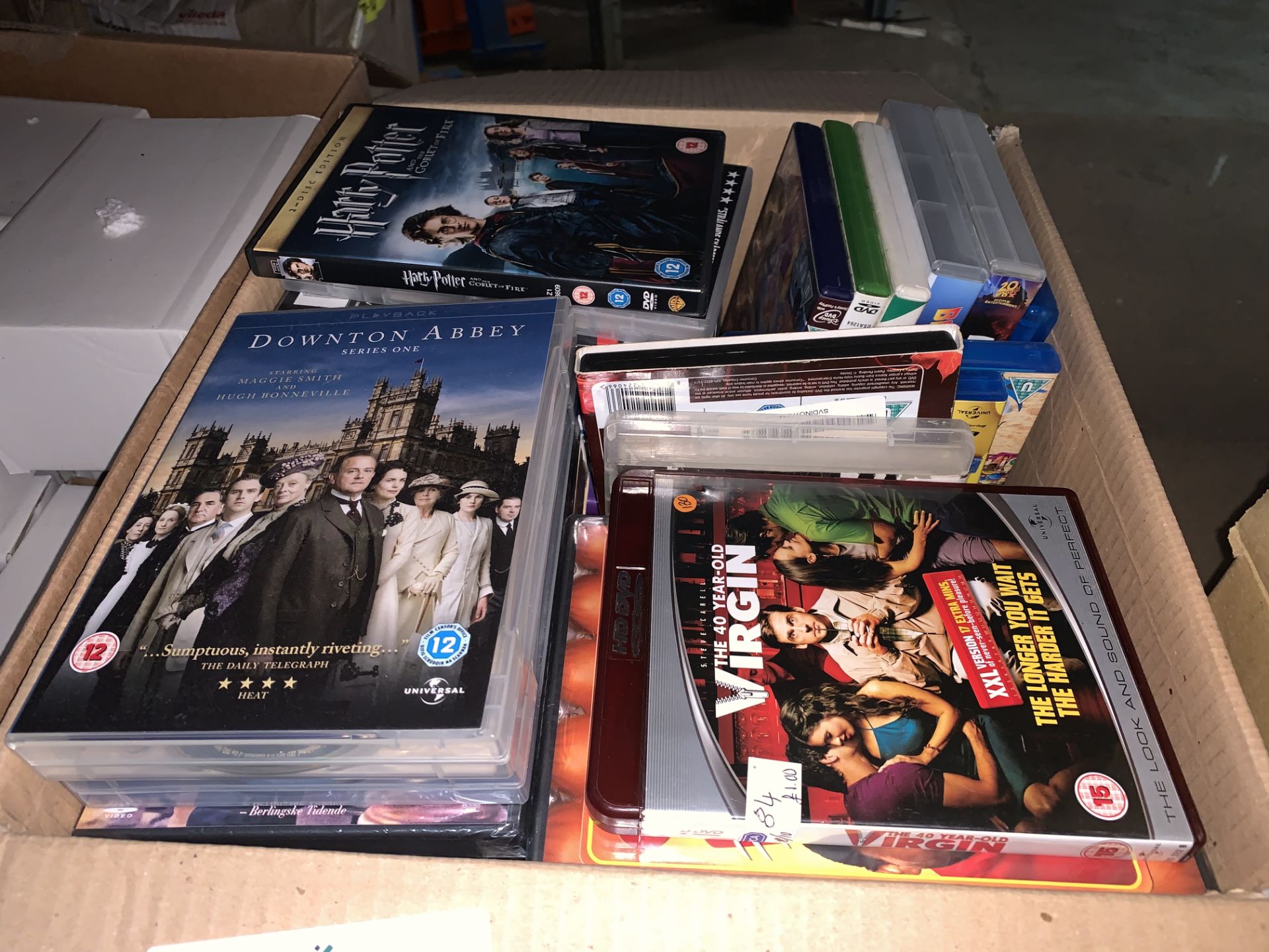 70 X VARIOUS DVDS INCLUDING THE 40 YEAR OLD VIRGIN, DOWNTON ABBEY, HARRY POTTER ETC