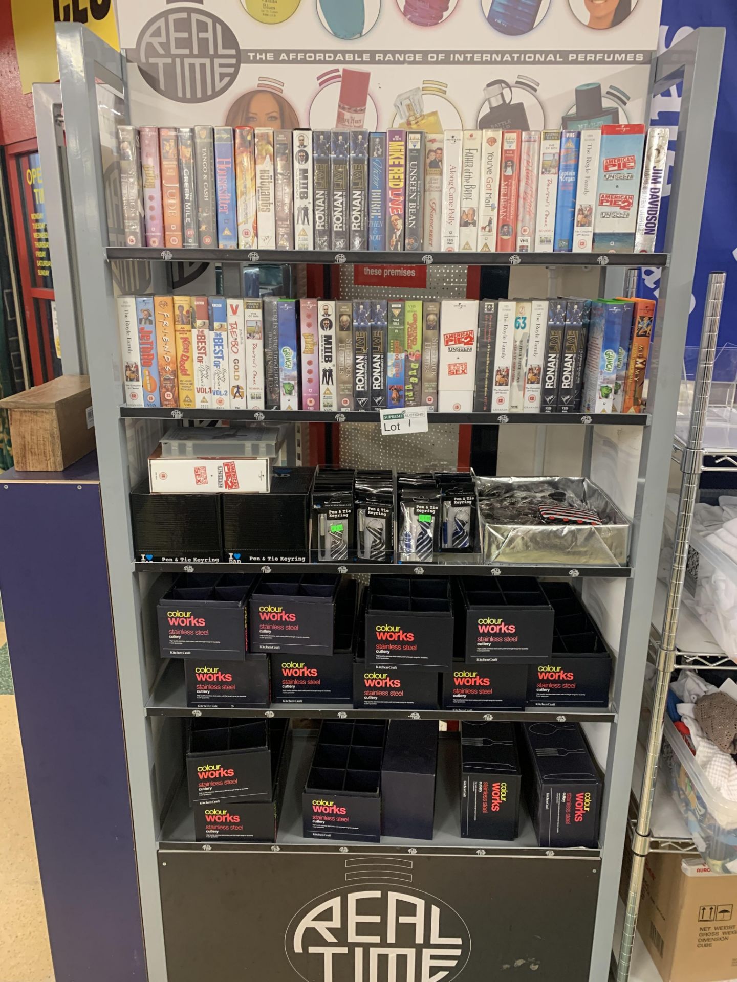 DISPLAY RACK AND BRAND NEW CONTENTS INCLUDING PEN AND TIE KEYRING SETS AND VHS