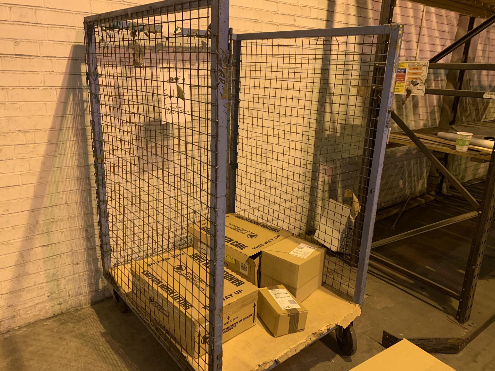 BLUE 4 WHEELED TROLLEY CAGE. NO CONTENTS INCLUDED