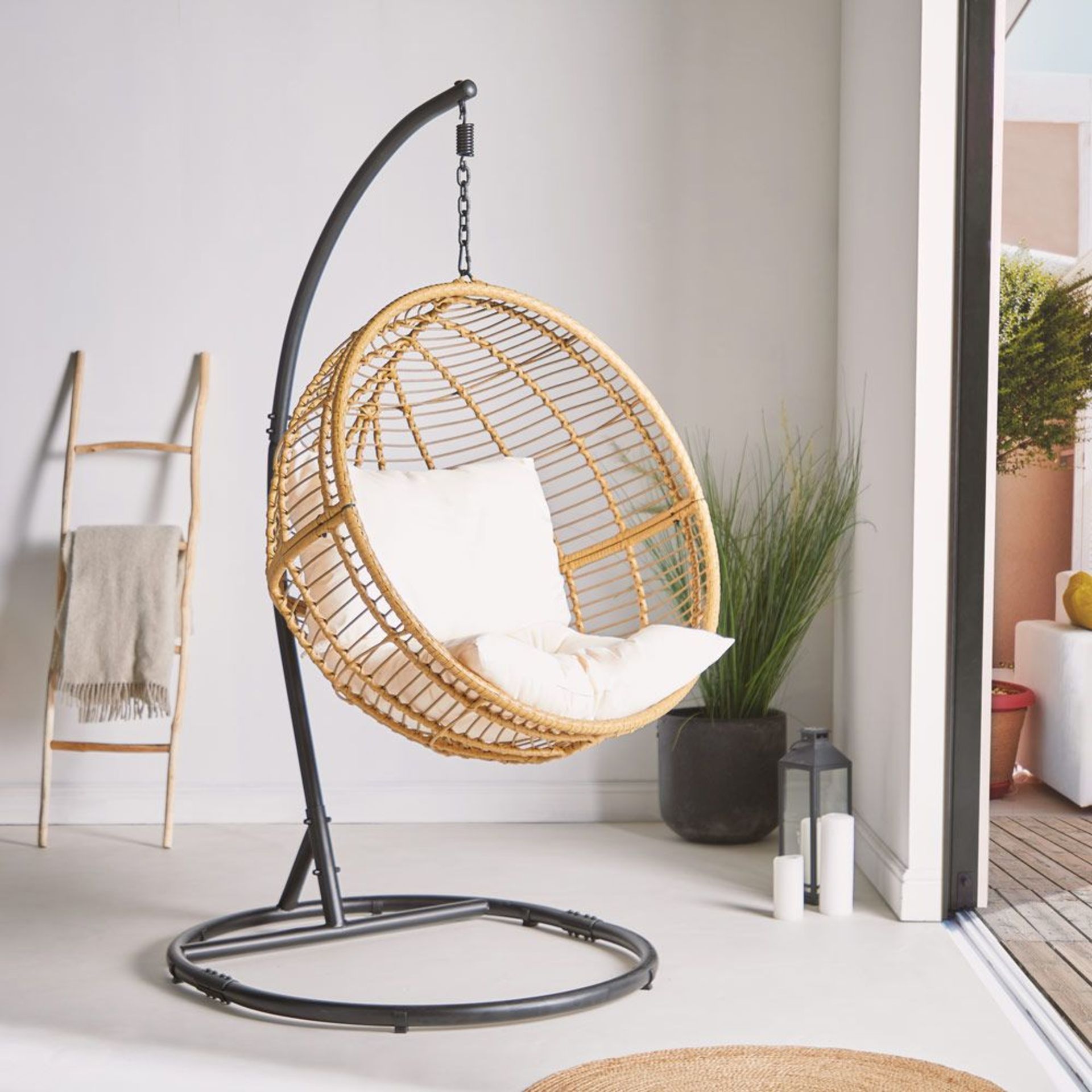 Rattan Hanging Egg Chair. The ultimate place to curl up with a book, get comfy in this cushioned