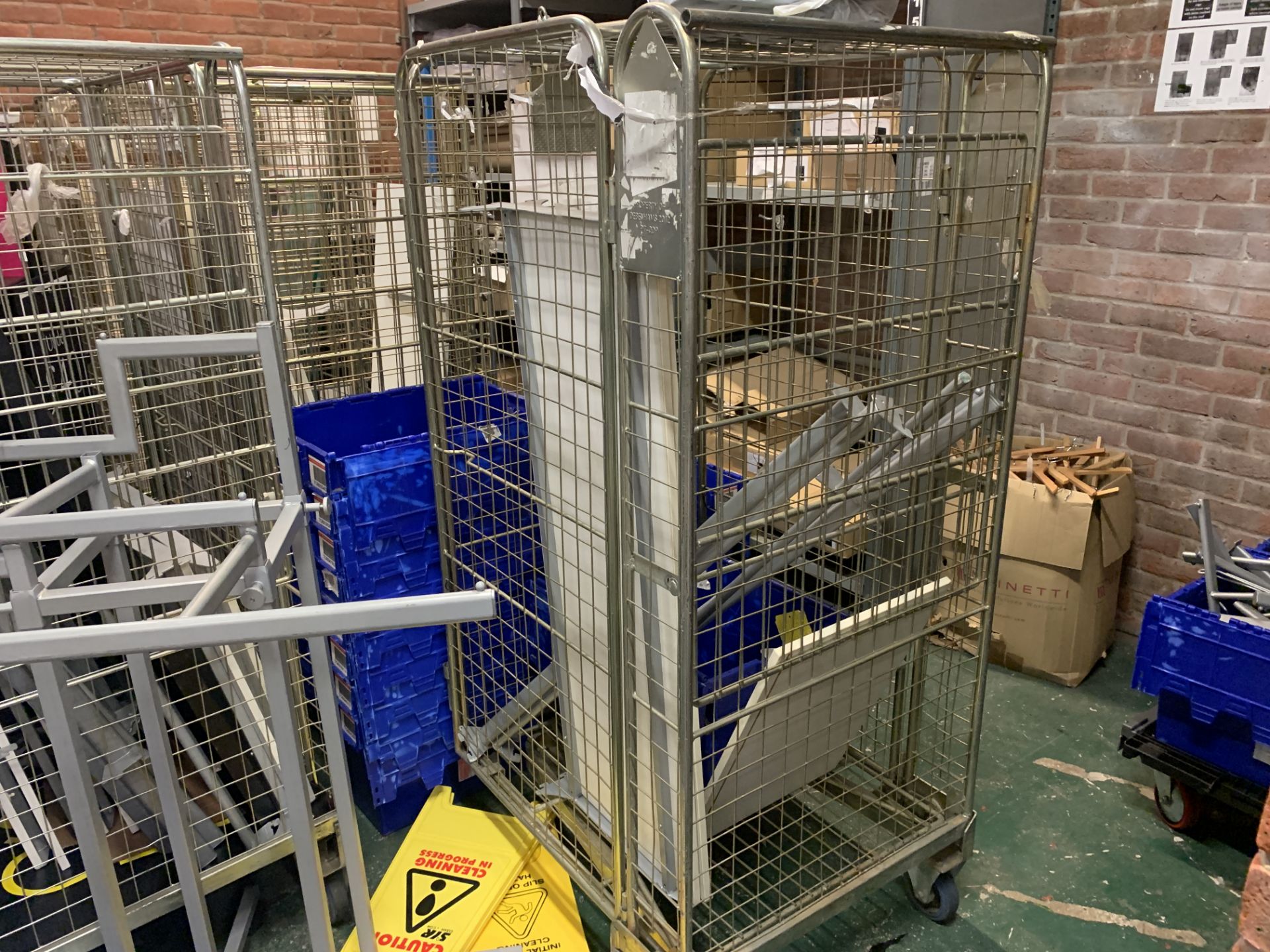 4 X WHEELED METAL CAGES AND CONTENTS