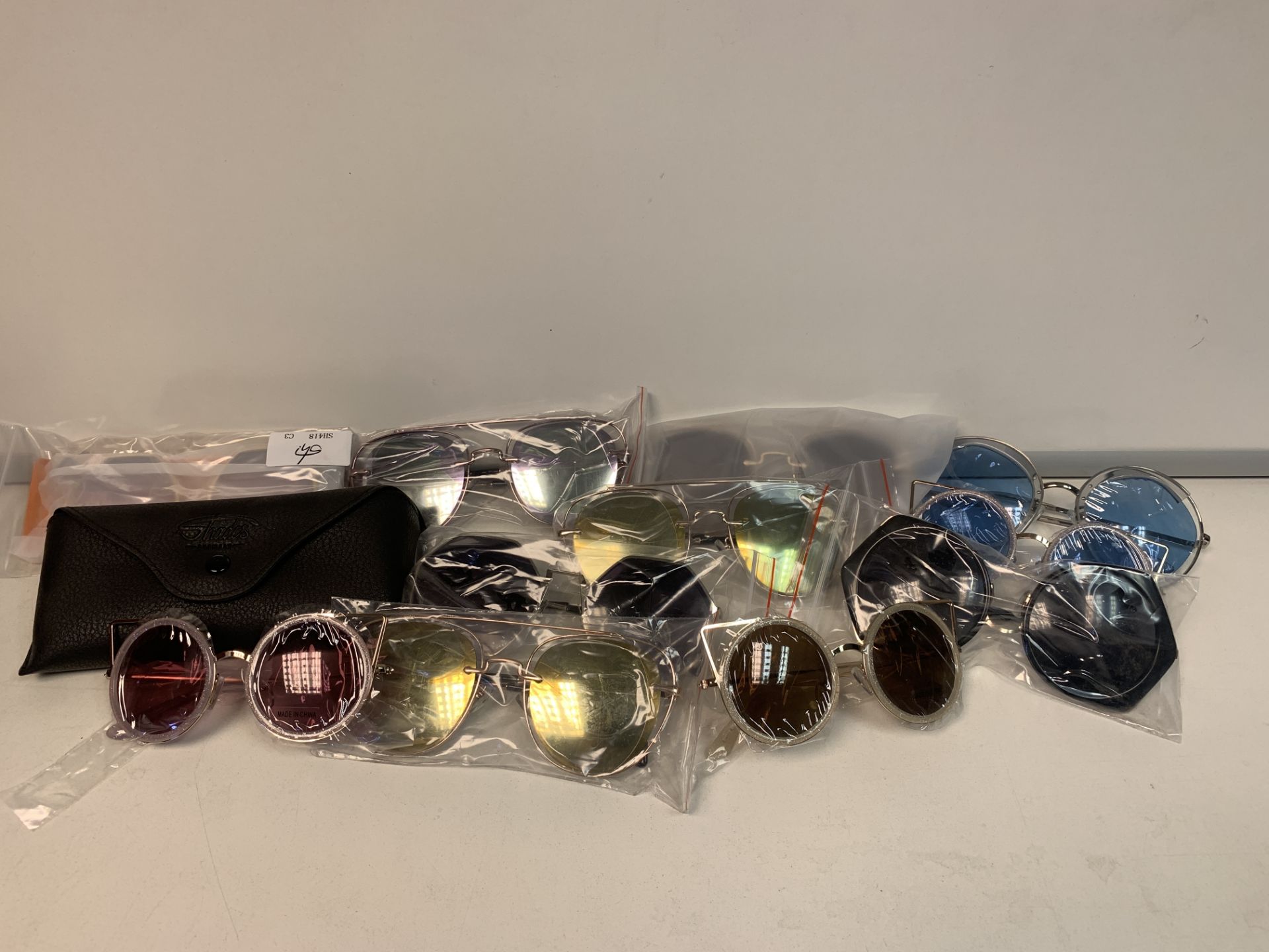 40 X NEW PACKAGED PAIRS OF SHADES SUN GLASSES IN ASSORTED DESIGNS (ROW1/2)