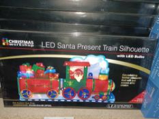 NEW BOXED 7 X LED SANTA PRESENT TRAIN SILHOUETTE WITH LEDS BULBS APPROX 24x45cm EYE CATCHER (