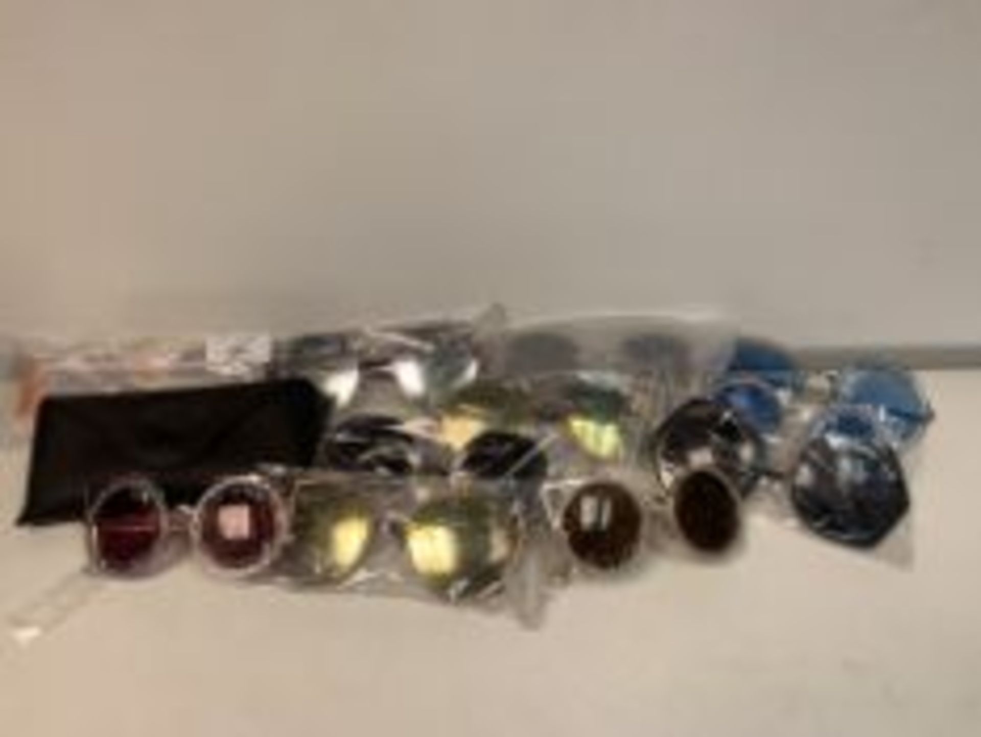 PALLET TO CONTAIN 400 X NEW PACKAGED PAIRS OF SHADES SUN GLASSES WITH CASES IN ASSORTED DESIGNS (