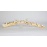 Ivory tusk carved with passage motifs.