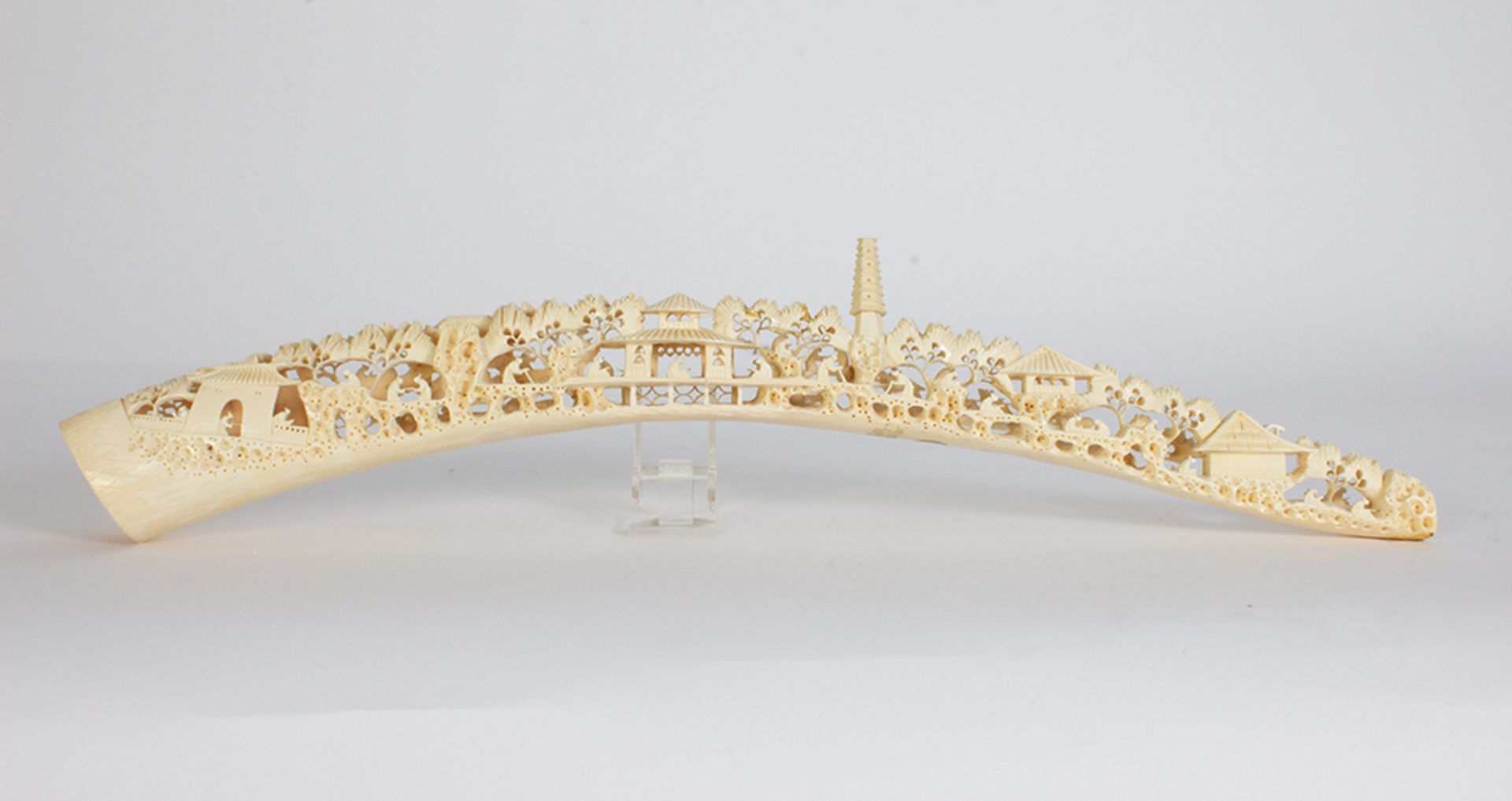 Ivory tusk carved with passage motifs.