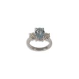 Ring in white gold, oval cut blue topaz and brilliant cut diamonds.