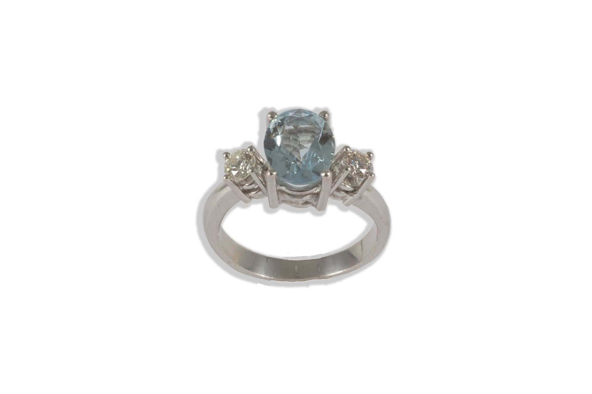 Ring in white gold, oval cut blue topaz and brilliant cut diamonds.