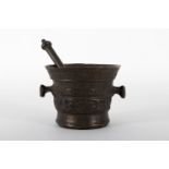 Bronze mortar with decoration in stripes of vegetal motifs and characters.