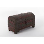 Trunk in wood covered with red cloth and wrought iron and embossed with nailing.