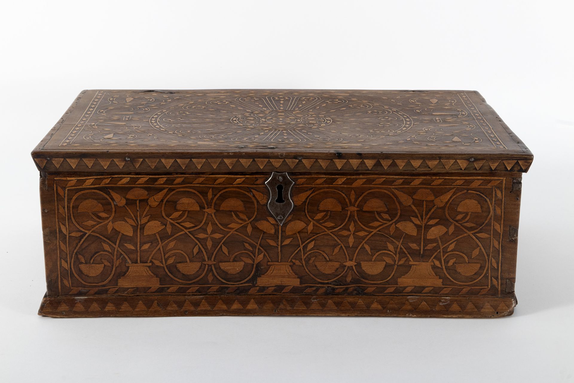 Walnut wood casket with boxwood inlay with geometric and plant motifs.