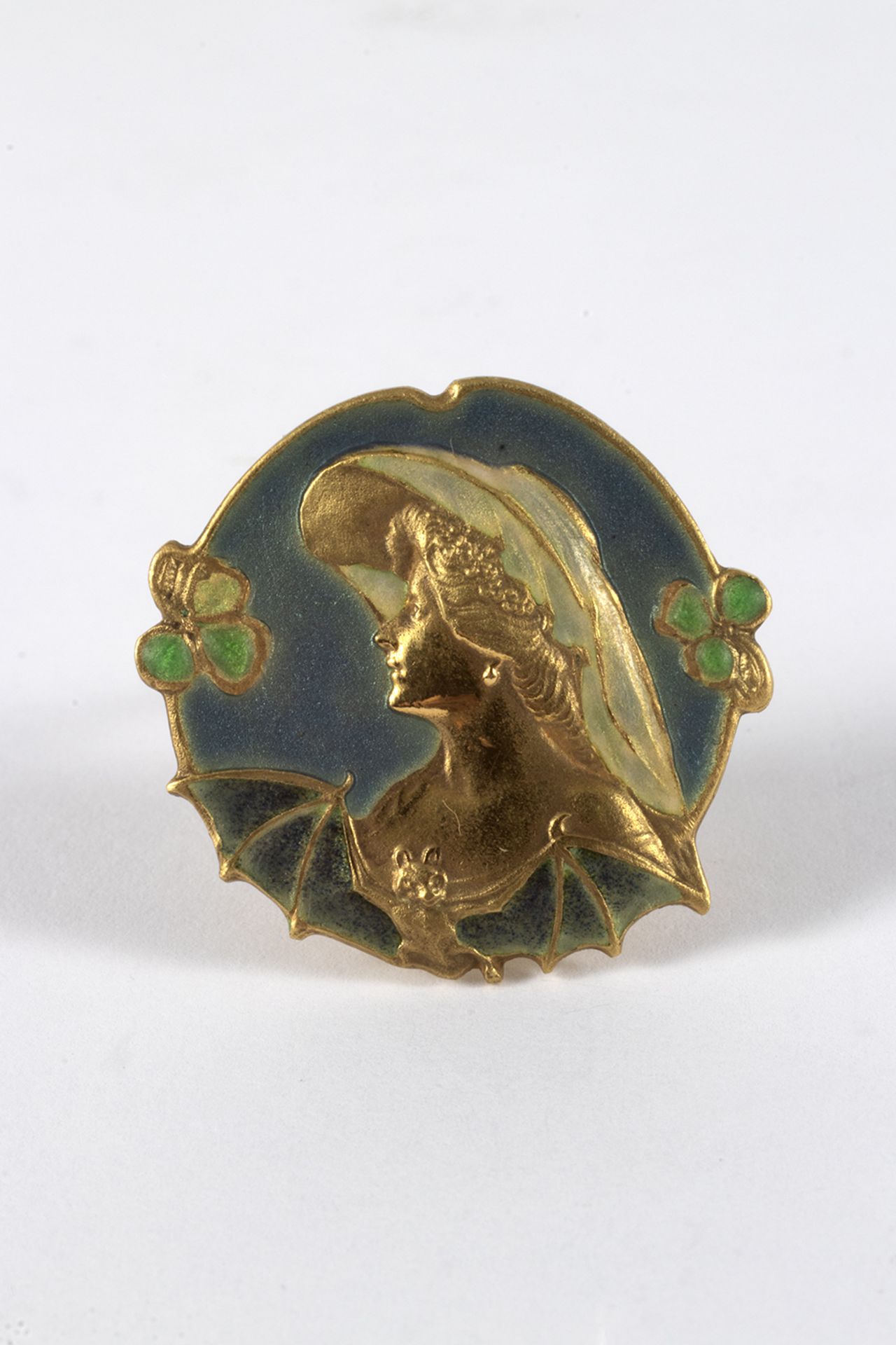 Art Nouveau style brooch in gold and enamel.