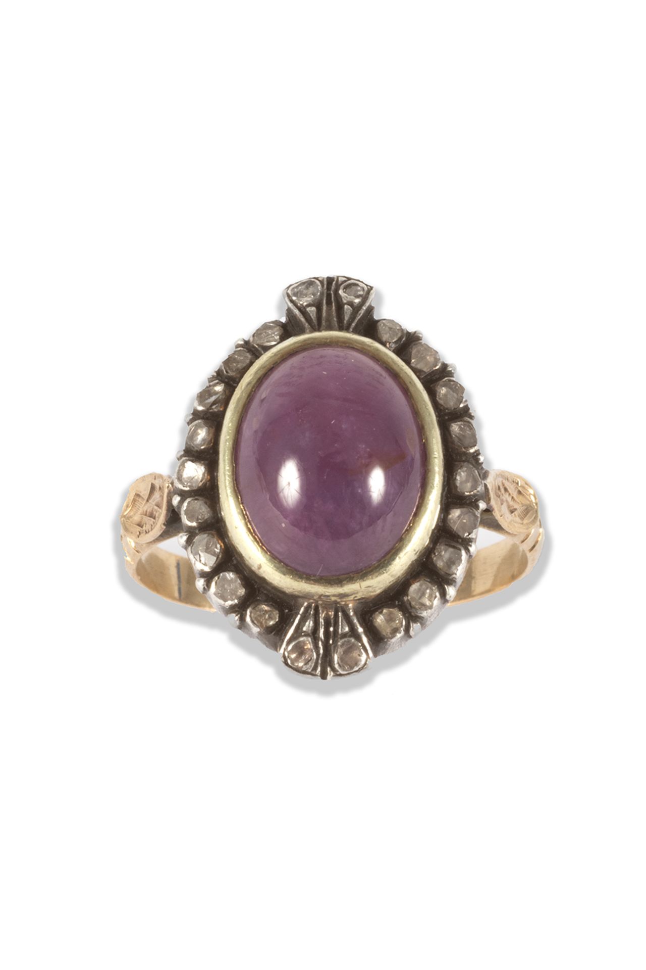 Ring in gold, silver, oval cabochon cut ruby and table cut diamond.
