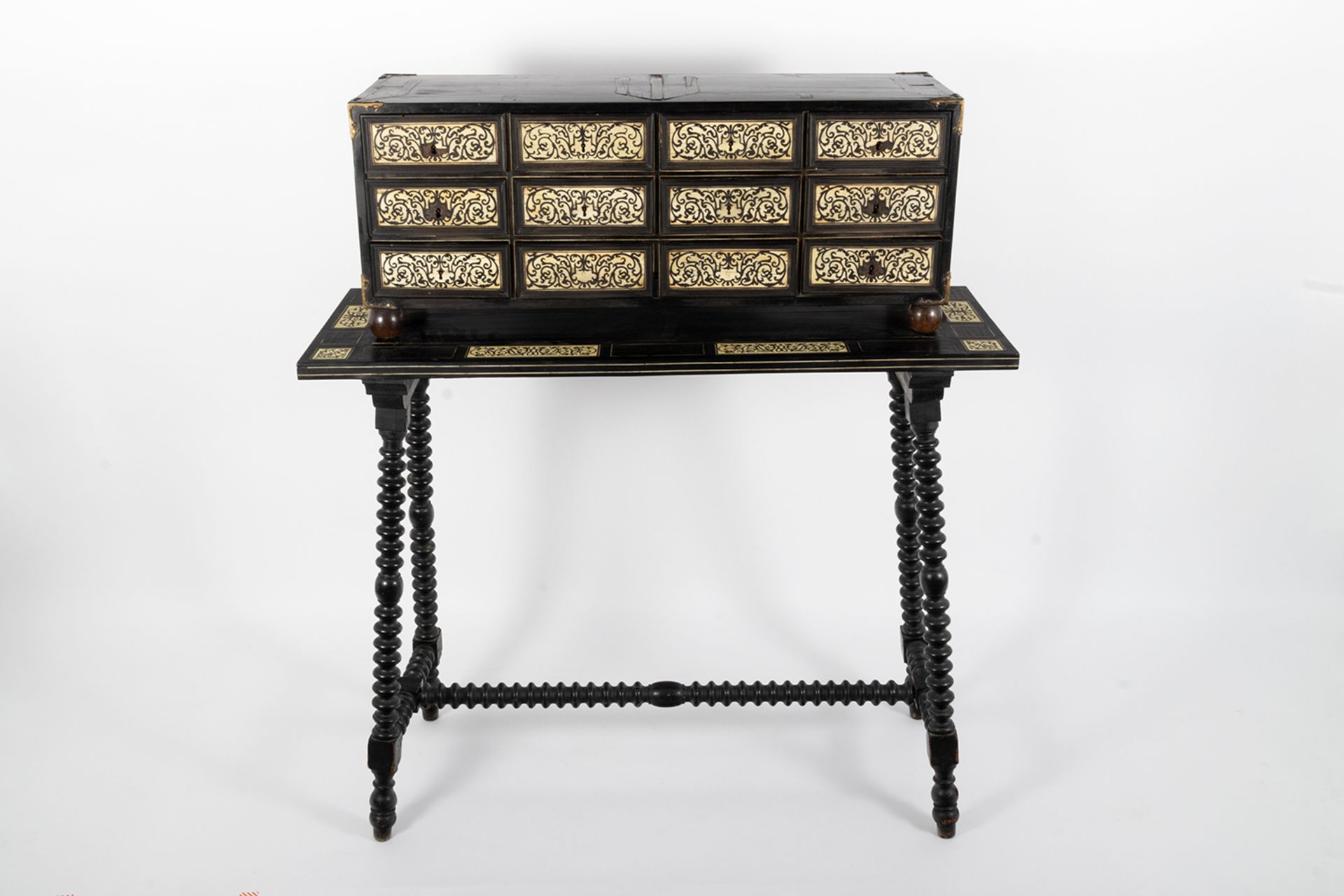 Chest with an ebony wood table and twelve drawers decorated with ivory pyrography plates with plant