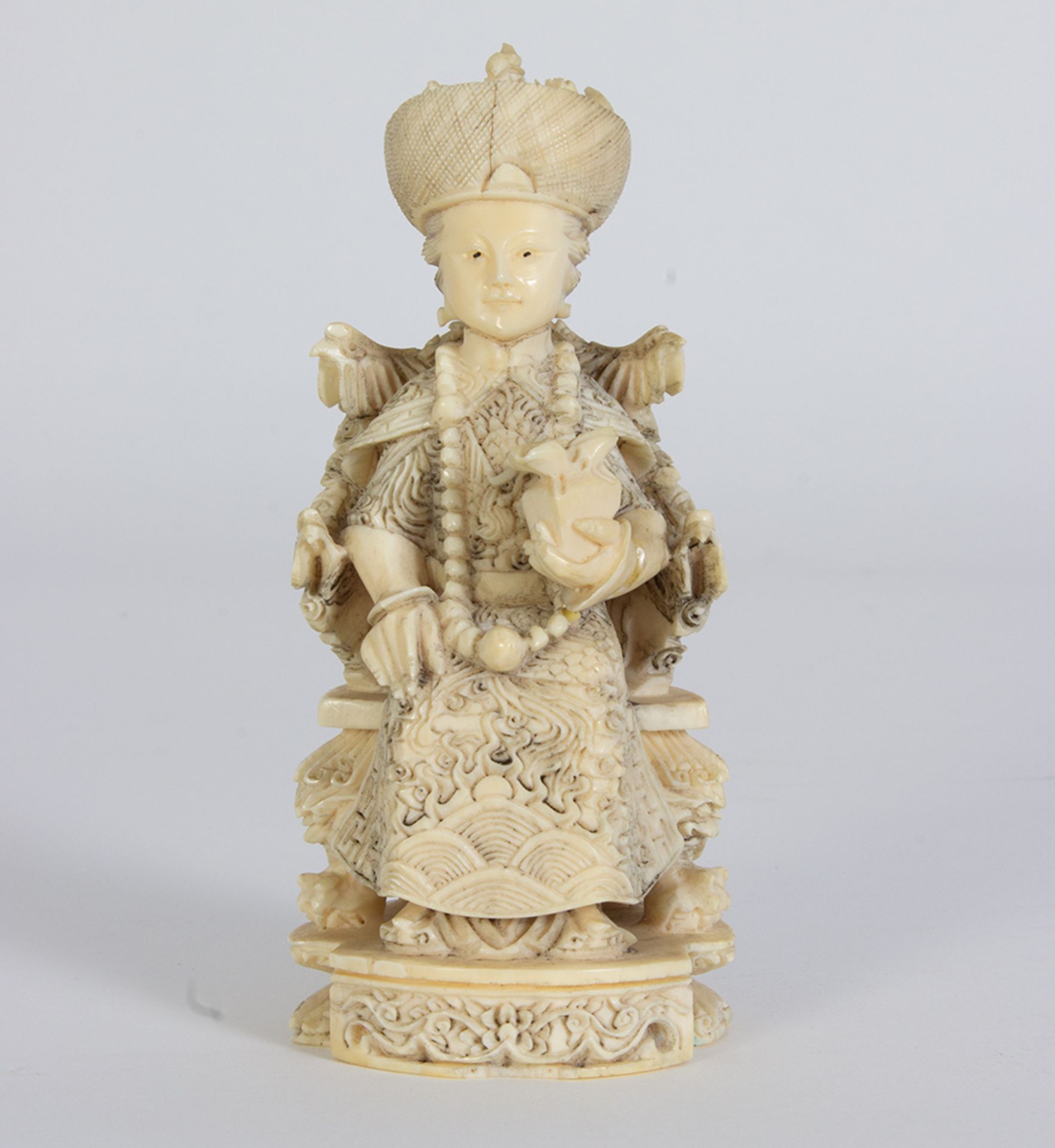 Pair of enthroned emperors in carved ivory.