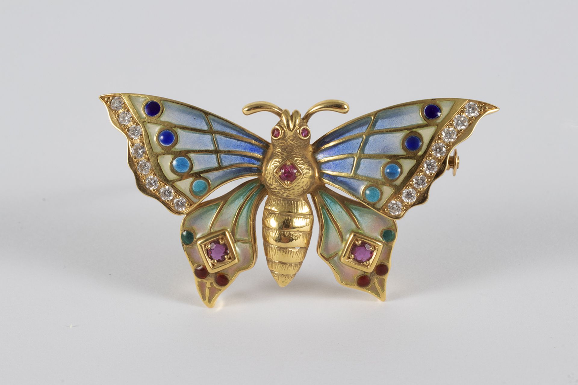 Butterfly brooch in gold, enamel, brilliant-cut diamonds and rubies.