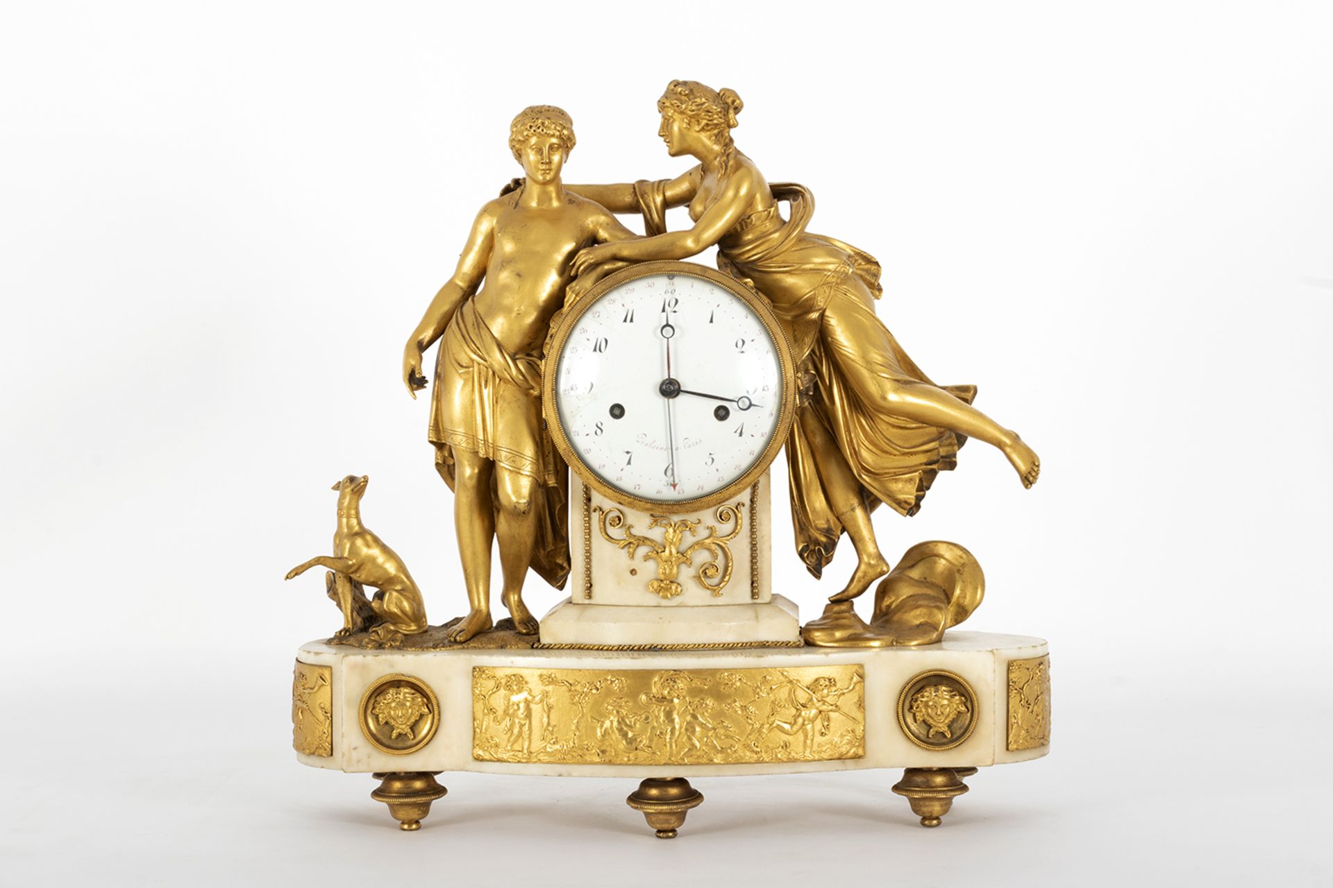 Empire table clock in gilt bronze and marble with representation of Venus and Adonis with dog and a 