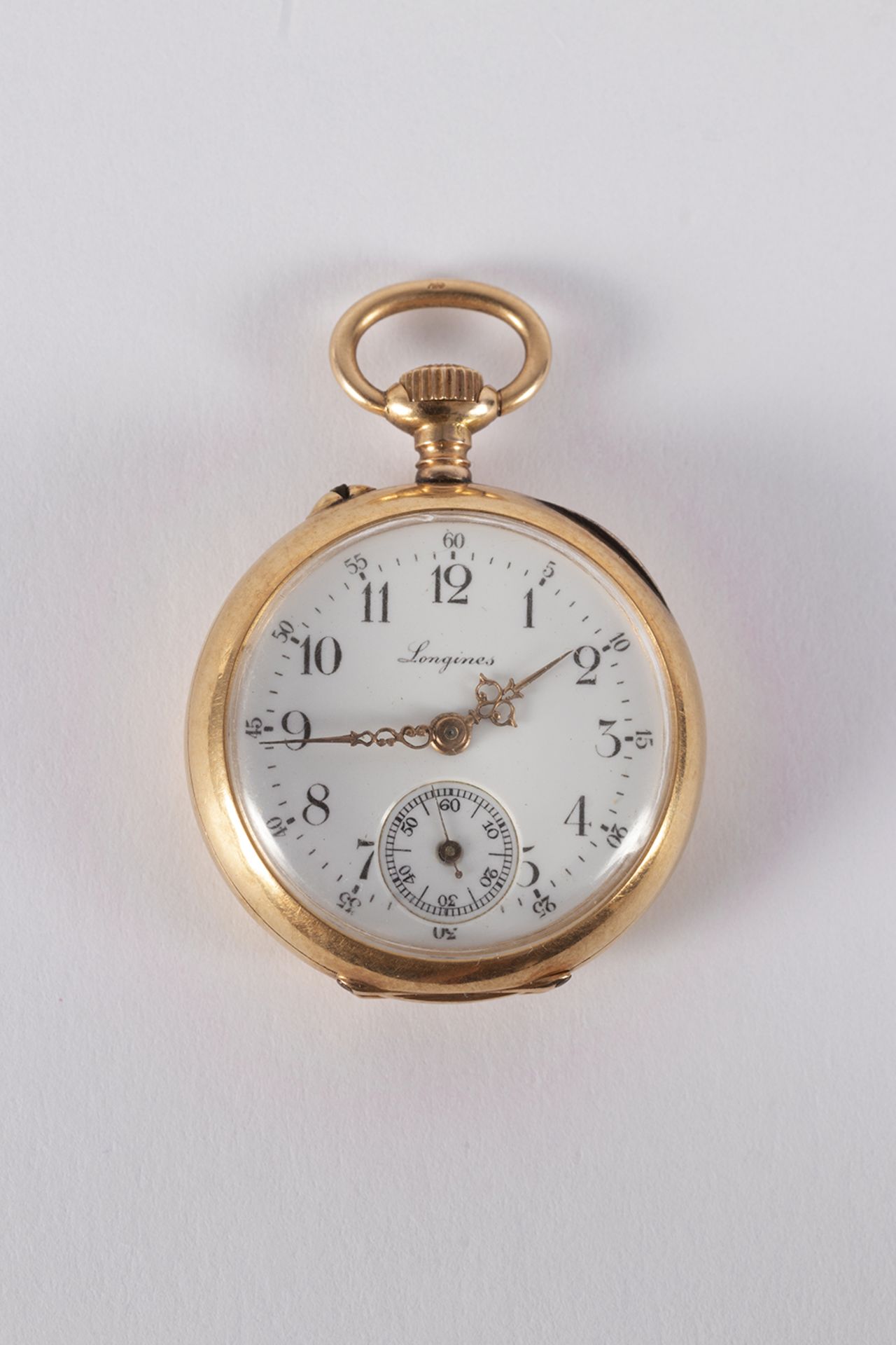 Longines hanging clock in gold, enamelled crown decoration on the reverse - remontaire mechanism.