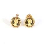 Gold earrings with reproduction of two-peso coins and diamonds, brilliant cut.
