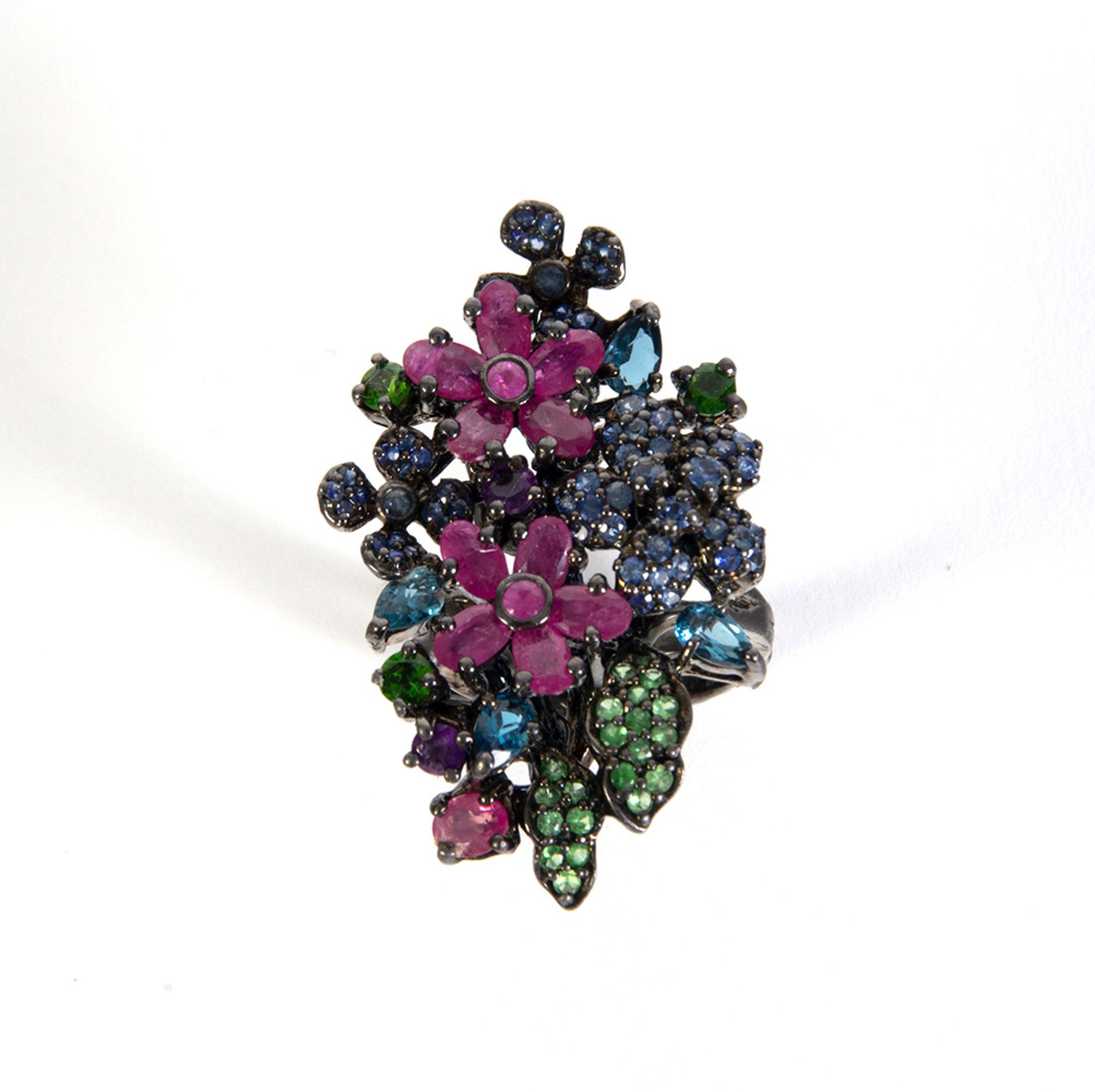 Blued silver ring, multicolored sapphires, oval and round cut ruby ​​flowers, green garnets and knob