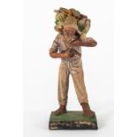 Farmer. Figure in polychrome terracotta. Philippines, late 19th century.