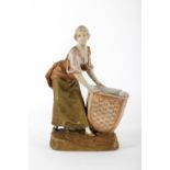 Girl with Royal Dux porcelain basket. Bohemia, circa 1900.