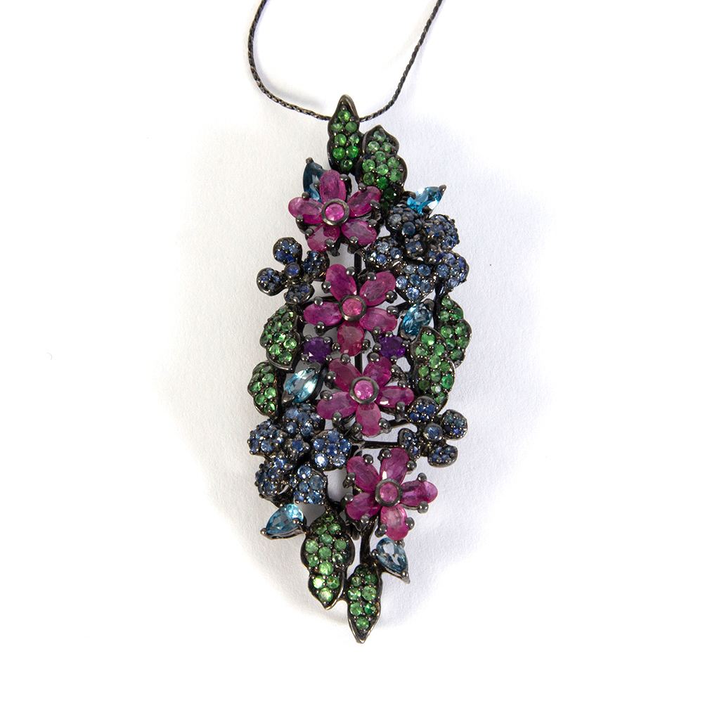 Blued silver pendant, colors of rubies and blue sapphires, zmatists and green garnets in different s