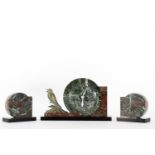 Art Deco table clock with a couple of sculptures in calamine and marble with a representation of a b