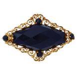 Gold and onyx brooch.