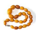 Antique egg yolk amber bead necklace largest bead measures approx 25mm by 18mm weight 37g