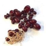 Cherry amber / bakelite bead necklace needs restringing largest bead measures approx 30mm by 22mm