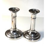 Pair of antique silver candlesticks each measures approx 15cm tall London silver hallmarks in good
