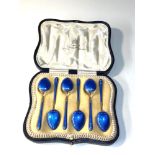 Antique boxed silver and enamel tea spoons in overall good condition one spoon has enamel wear to