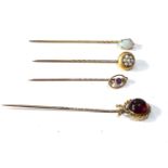 4 antique stick pins set with opal garnet and seed pearls 1 hallmarked 15ct