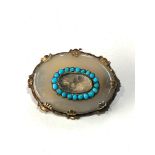 Antique gold framed turquoise and stone set mourning brooch measures approx 4.3cm by 3.3cm