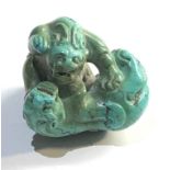 Chinese turquoise stone fighting lions netsuke type figure measures approx 32mm by 27mm