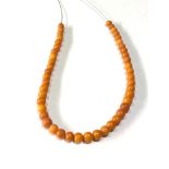 Antique egg yolk amber bead necklace small even sized beads weight 9g