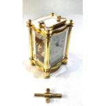 Fine quality brass carriage clock by Fox & Simpson measures approx 12cm tall not including handle