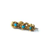 small high carat gold & turquoise brooch measures approx 2.2cm weight 1.8g