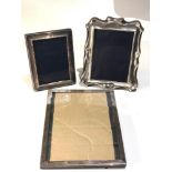 3 silver picture frames one missing back stand largest measures approx 22cm by 17cm