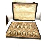 Boxed set of antique continental hallmarked 12 800 silver teaspoons including sifter