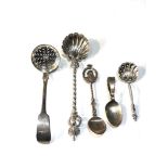 Selection of 4 silver hallmarked items includes ornate serving spoons and large ornate continental