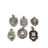 Selection of antique silver pocket watch chain fobs