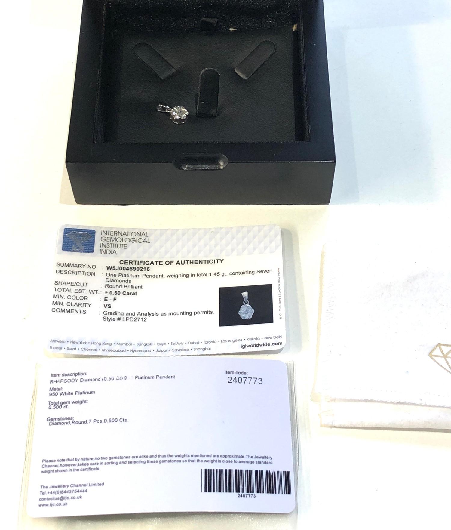 Designer Rhapsody platinum and diamond pendant containing seven diamonds round brilliant gem