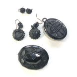 Selection of victorian jet jewellery includes pendant brooch and earrings central panel of earring