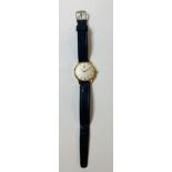 Vintage mens Tissot wristwatch, leather strap, watch winds and ticks but no warranty is given,