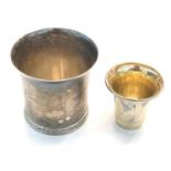 2 silver beakers largest measures approx 6cm tall dia 6.2cm small beaker measures approx 4.2cm