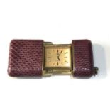 Antique swiss purse watch in red leather case in good condition working order but no warranty